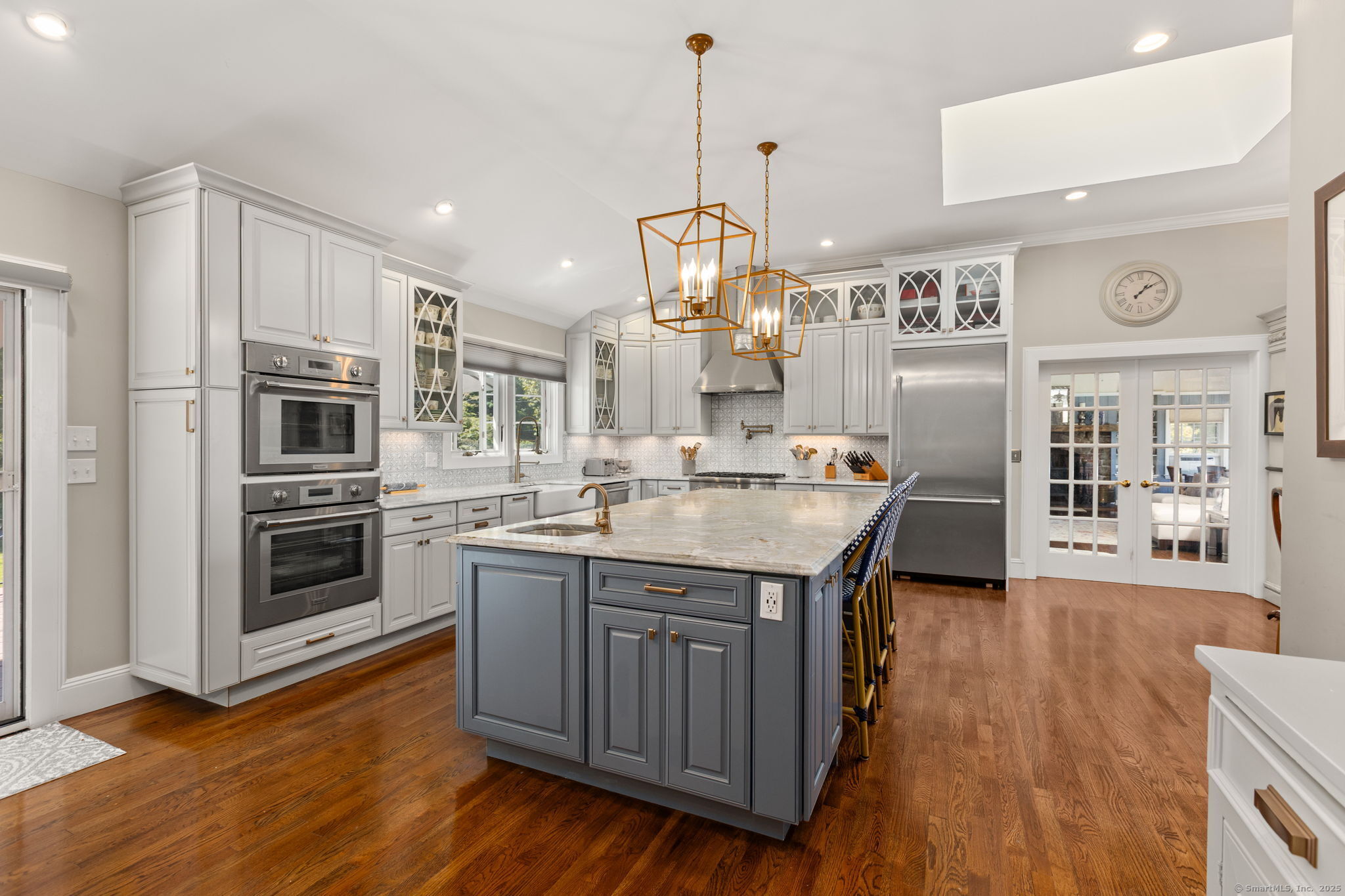 803 North Salem Road Ridgefield, CT 06877 - Photo 17 of 40 a kitchen with stainless steel appliances granite countertop a sink a stove and a wooden floors