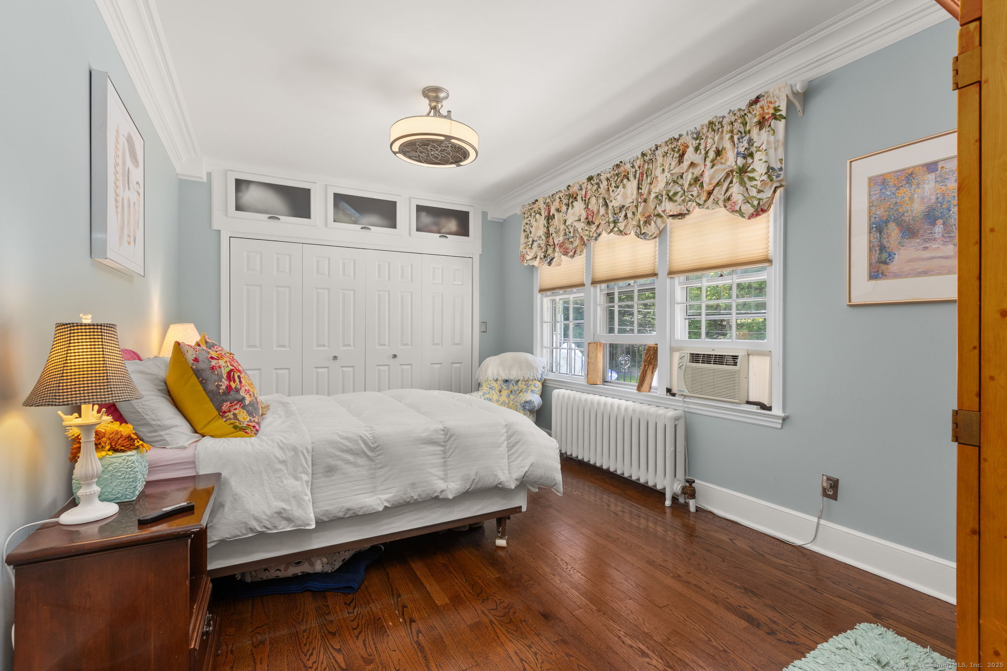 803 North Salem Road Ridgefield, CT 06877 - Photo 24 of 40 a bedroom with a bed and wooden floor