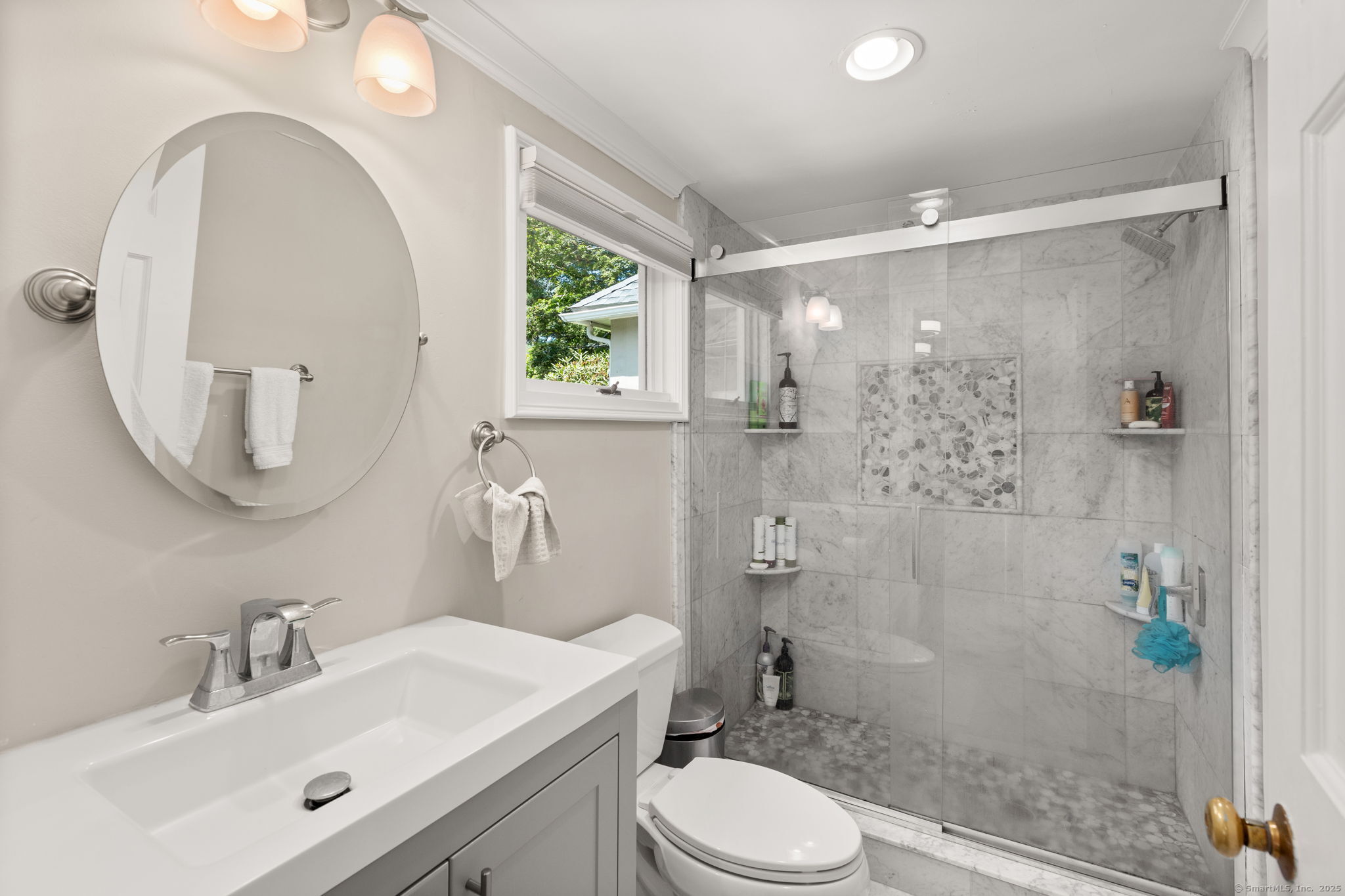 803 North Salem Road Ridgefield, CT 06877 - Photo 25 of 40 a bathroom with a sink a toilet and a mirror