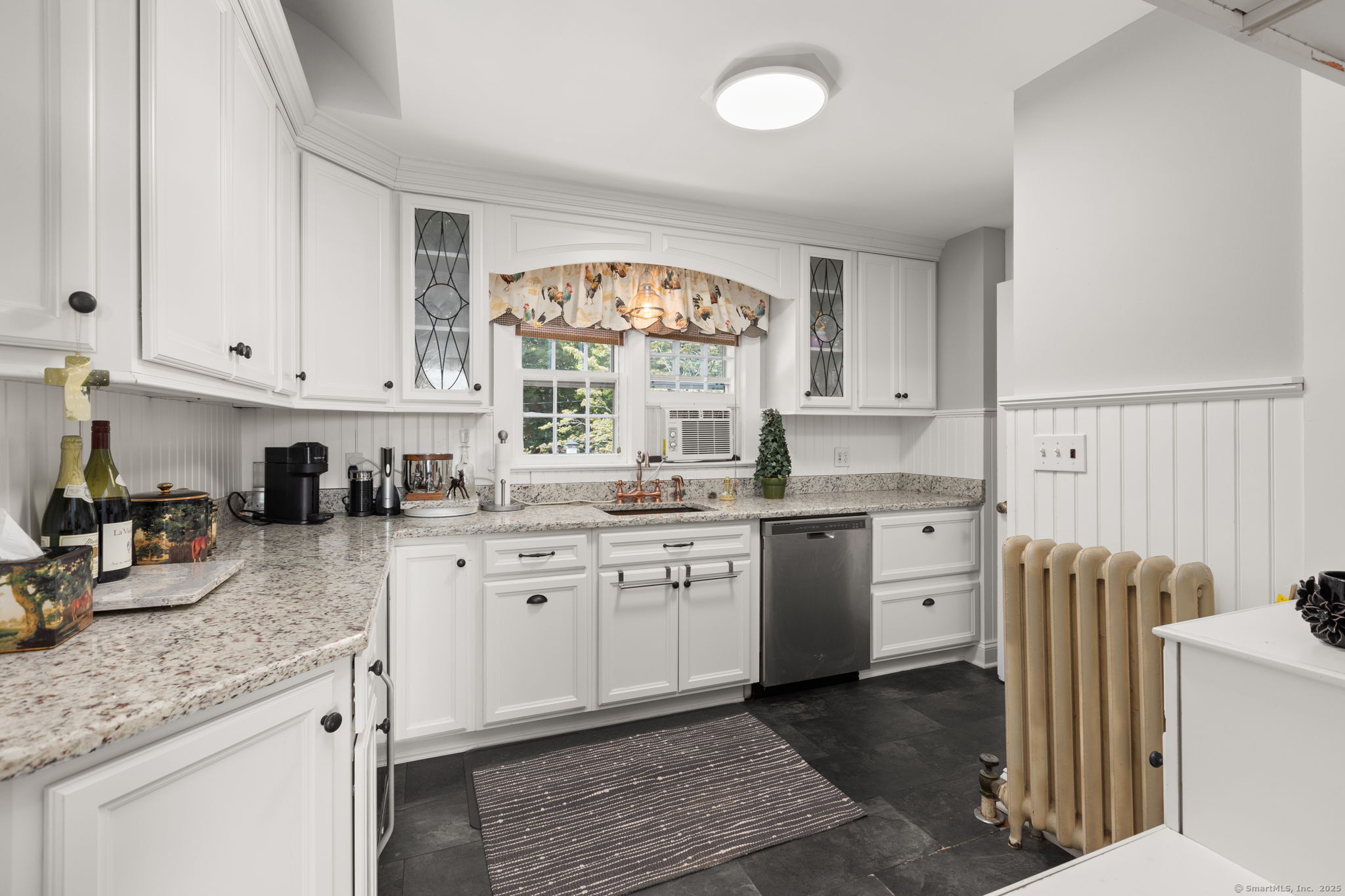 803 North Salem Road Ridgefield, CT 06877 - Photo 27 of 40 a kitchen with granite countertop a sink window and cabinets