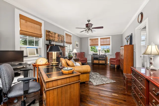 a work room with furniture and windows