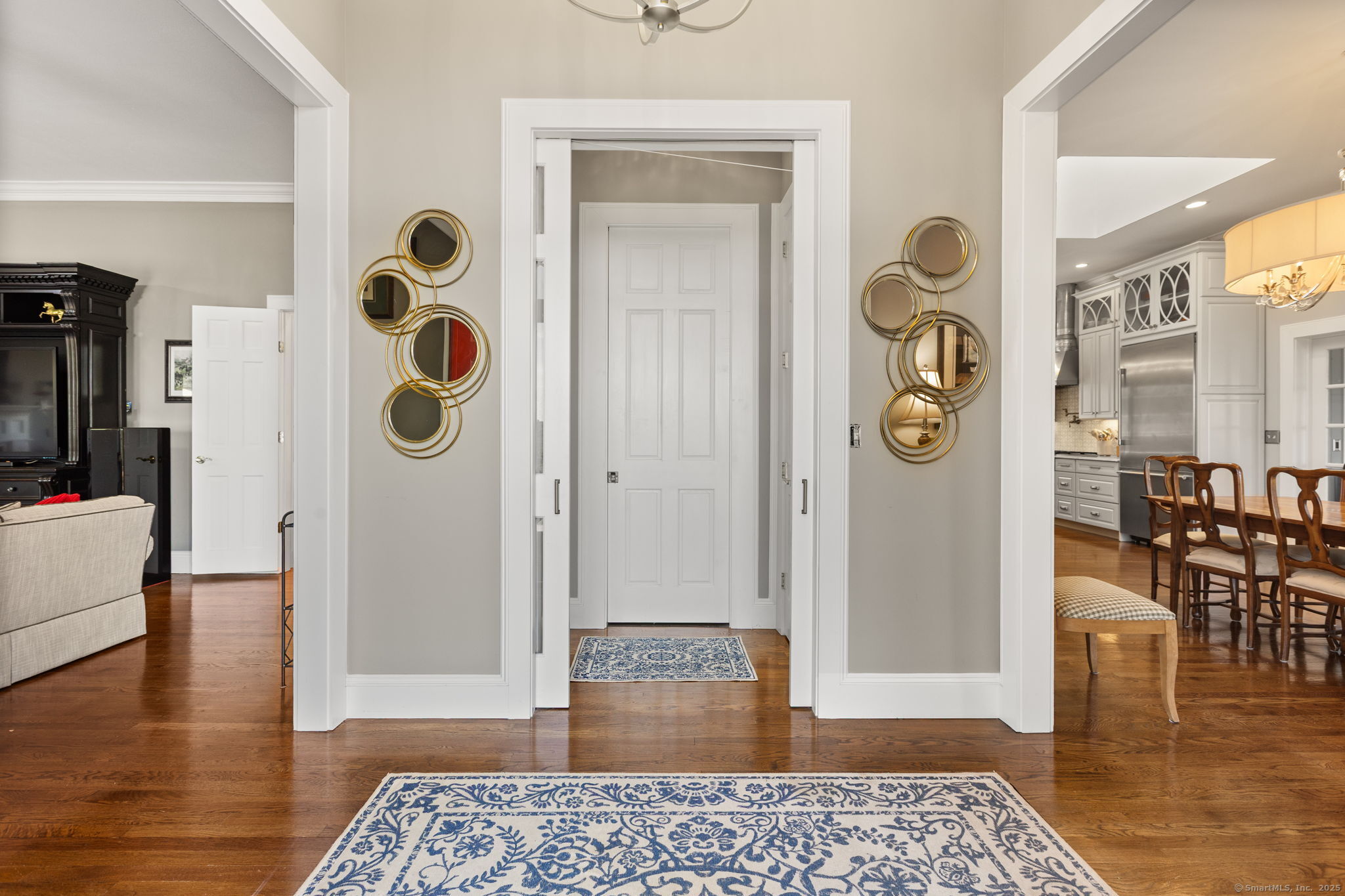 803 North Salem Road Ridgefield, CT 06877 - Photo 4 of 40 a view of a hallway with wooden floor and dining room