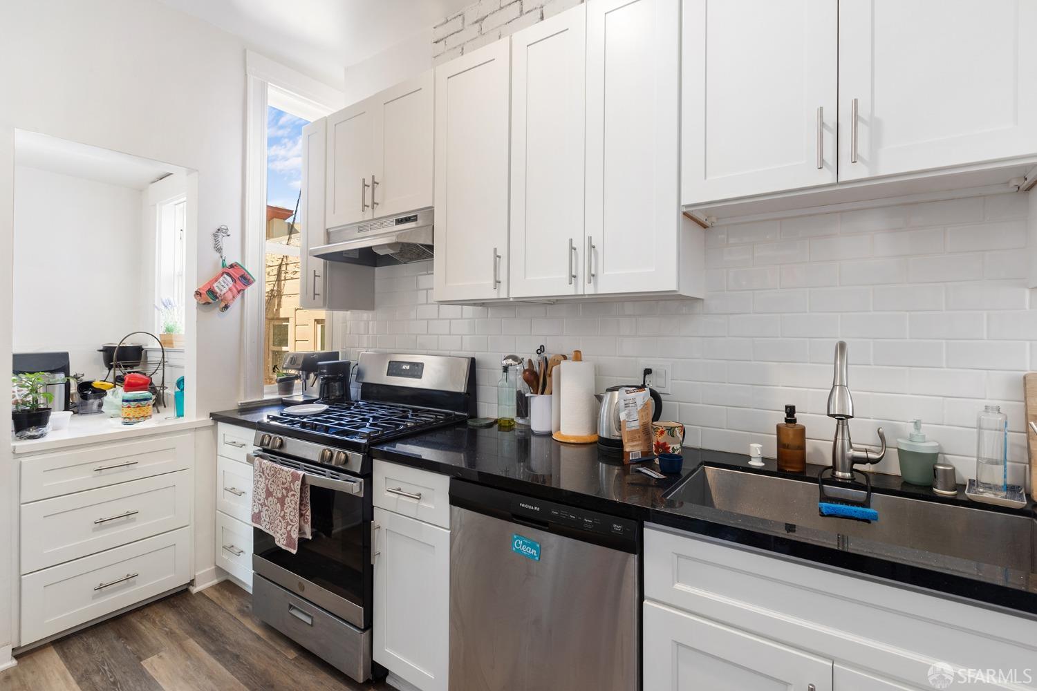 1968 Post Street San Francisco, CA 94115 - Photo 9 of 21 a kitchen with white cabinets and appliances