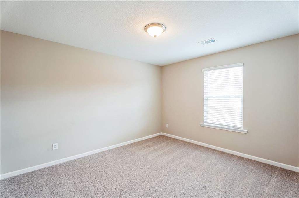 23 Whiterock Road Phenix City, AL 36869 - Photo 5 of 29 Carpeted empty room featuring baseboards and visible vents