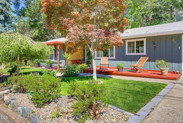 a house view with a sitting space and garden