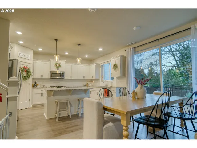 a kitchen with a table and chairs in it