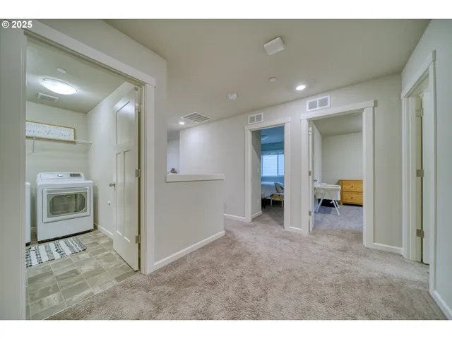 a view of a livingroom with a kitchen