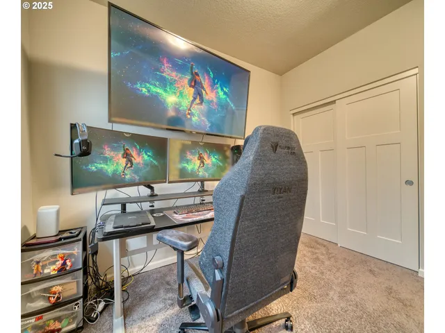 a view of a workspace with furniture