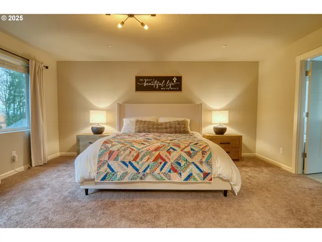 a bedroom with a bed and a view of bedroom