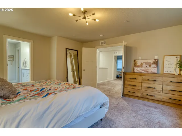 a bathroom with a sink a large mirror and a shower