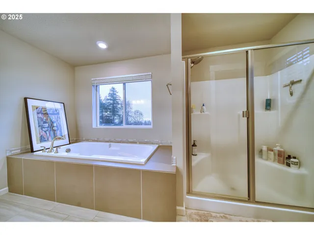 a white toilet sitting next to a white wall