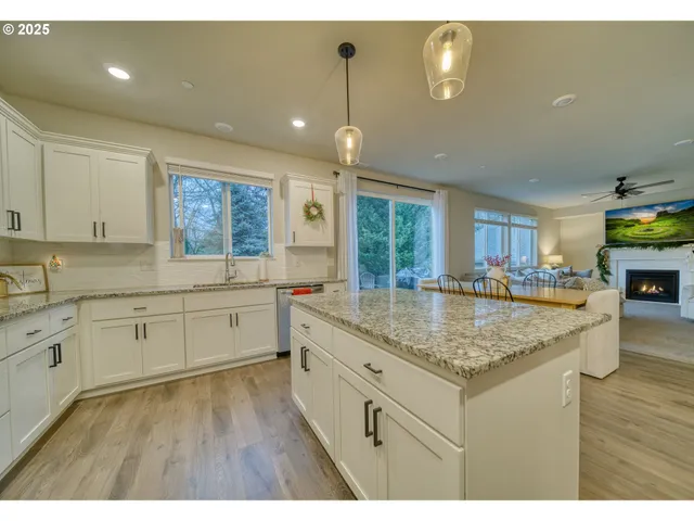 a kitchen with counter top space sink and center island
