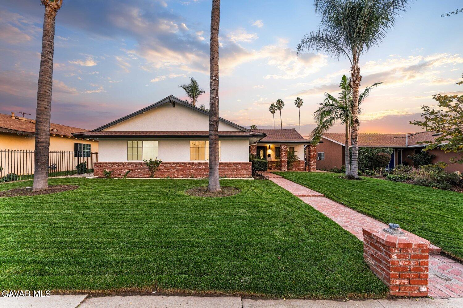 12338 Sheldon Street Sun Valley, CA 91352 - Photo 2 of 60 a front view of a house with a yard