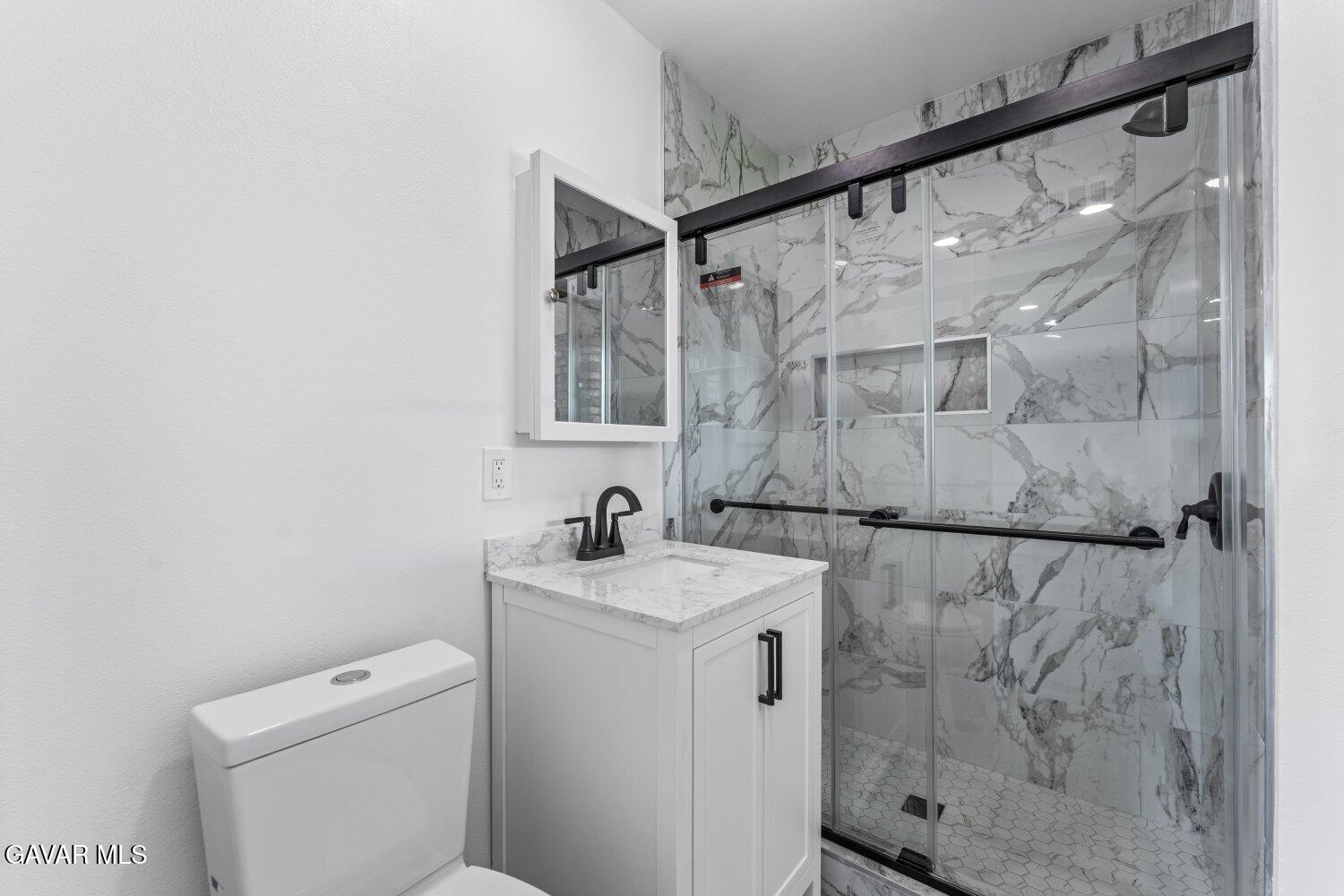 12338 Sheldon Street Sun Valley, CA 91352 - Photo 21 of 60 a bathroom with a sink toilet and shower