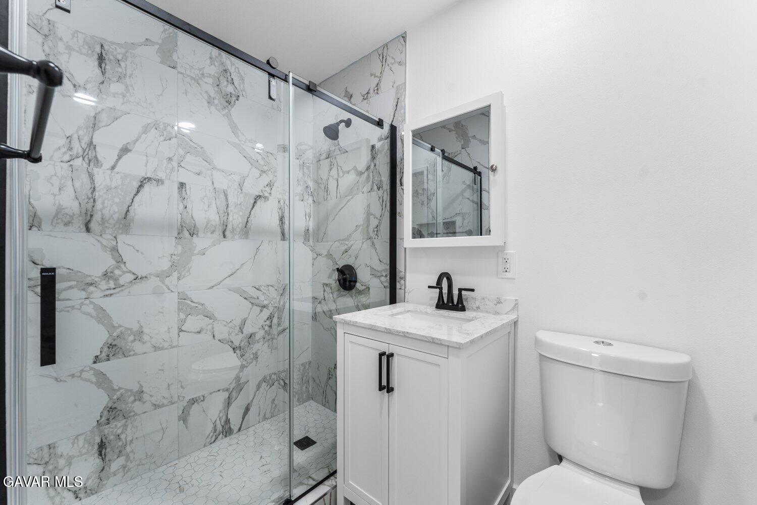 12338 Sheldon Street Sun Valley, CA 91352 - Photo 27 of 60 a bathroom with a sink toilet and shower