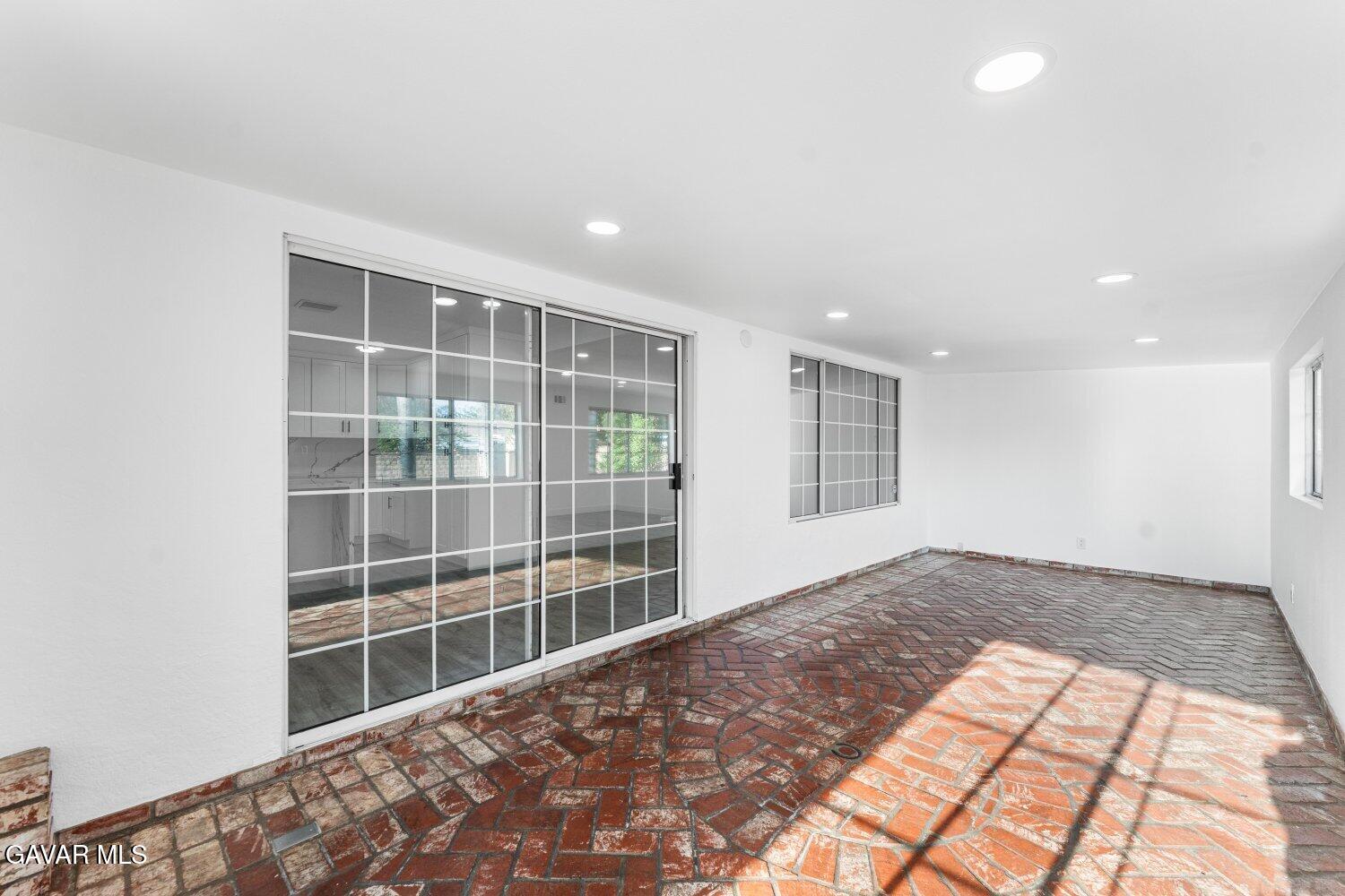 12338 Sheldon Street Sun Valley, CA 91352 - Photo 28 of 60 a view of empty room with windows