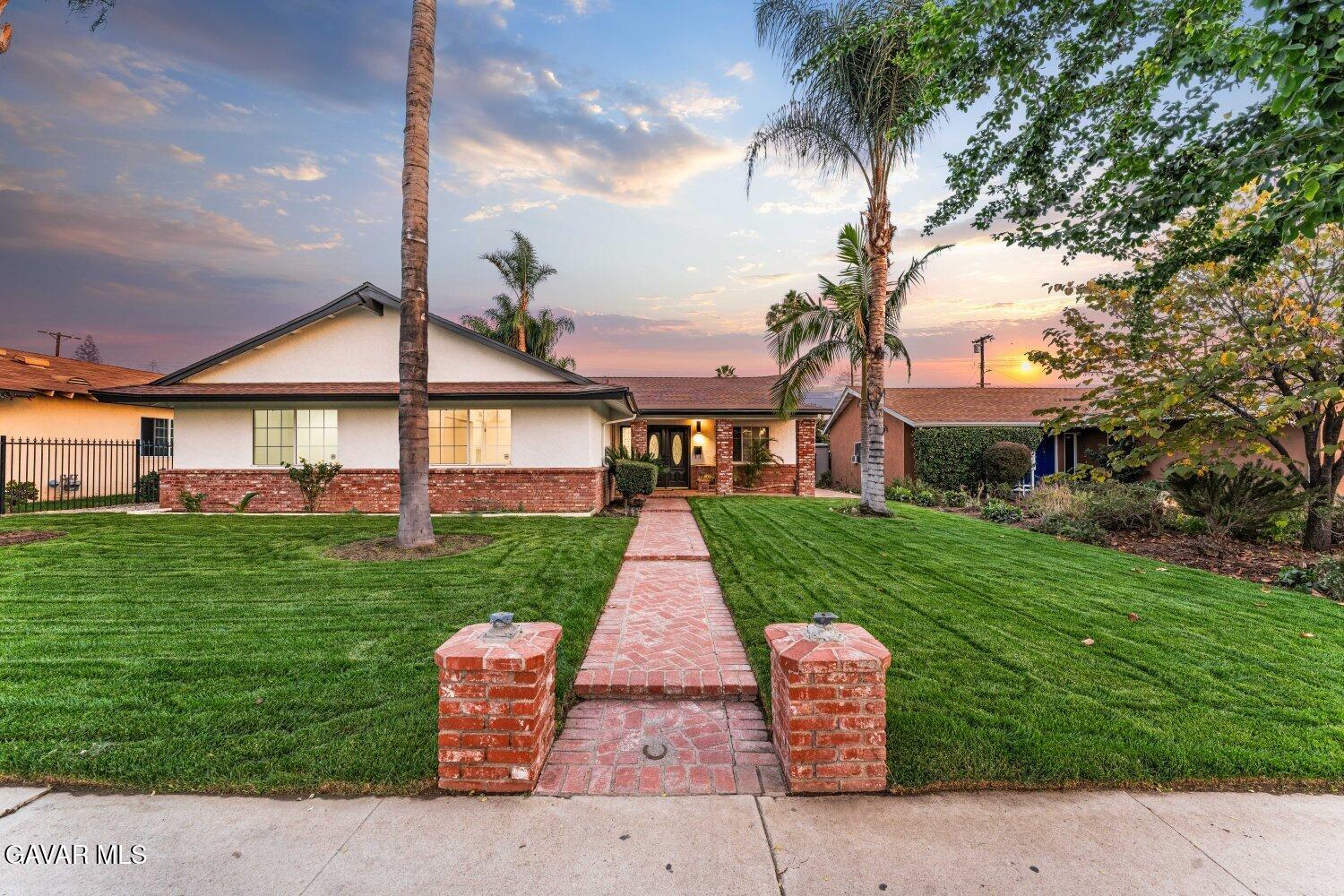 12338 Sheldon Street Sun Valley, CA 91352 - Photo 3 of 60 a front view of a house with a yard