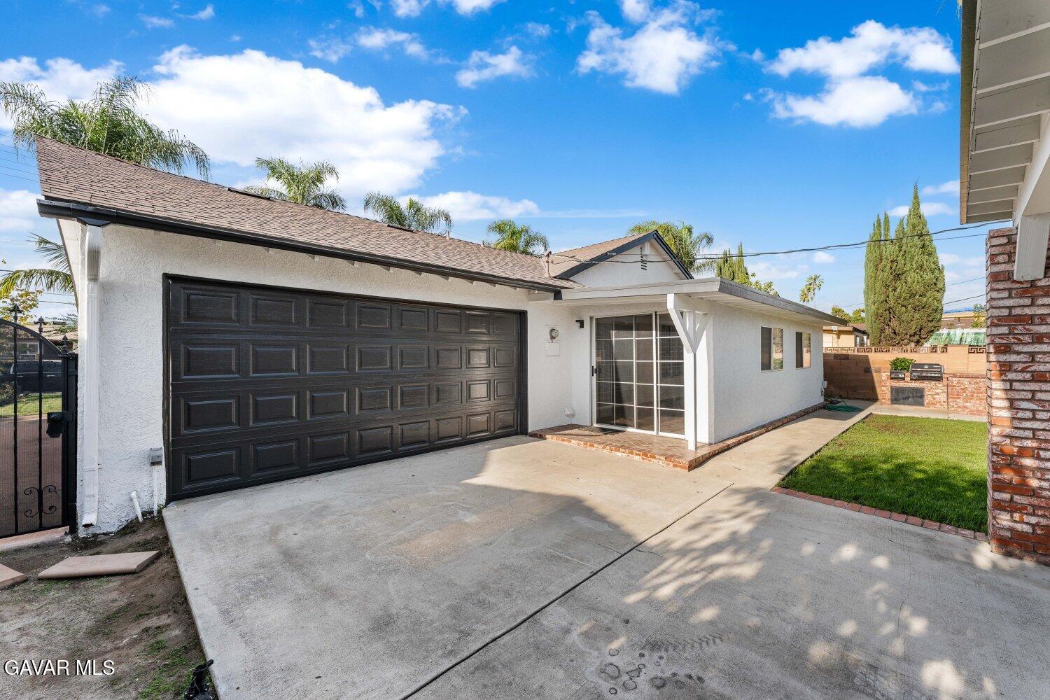 12338 Sheldon Street Sun Valley, CA 91352 - Photo 42 of 60 a front view of a house with a garage