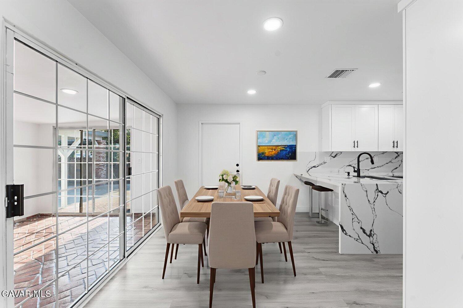 12338 Sheldon Street Sun Valley, CA 91352 - Photo 53 of 60 a view of a dining room with furniture and wooden floor