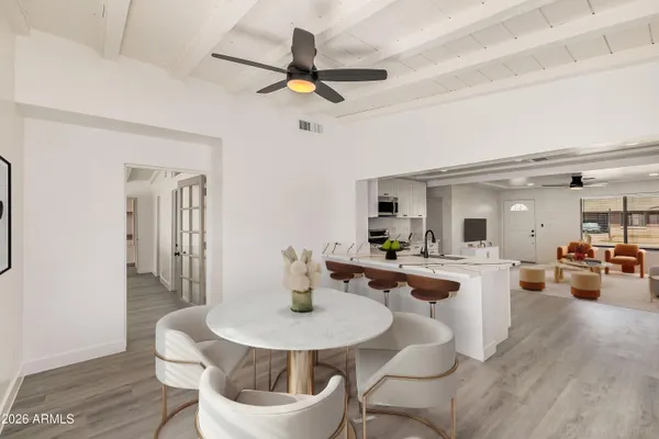 a room with a sink cabinets and wooden floor