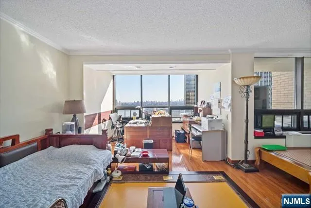 a room with furniture water view and a large window