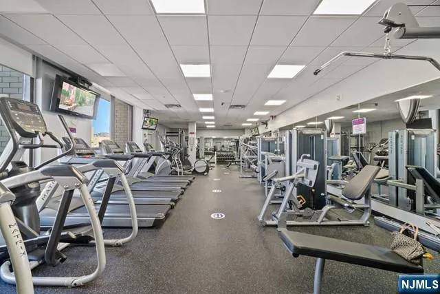 a view of a hall with wooden floor