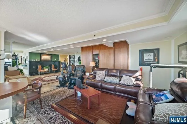 a room with lots of potted plants and wooden floor