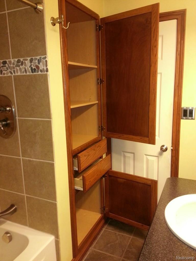 5412 Sutton Road Dryden, MI 48428 - Photo 11 of 24 built in linen closet bath.