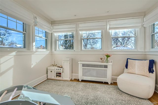 a living room with furniture and a bathtub