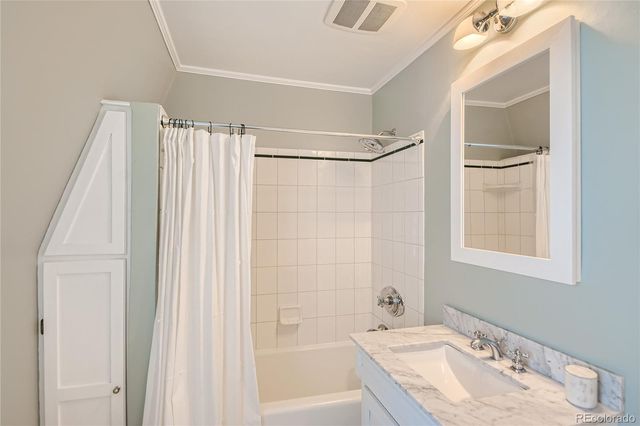 a bathroom with a tub and a sink