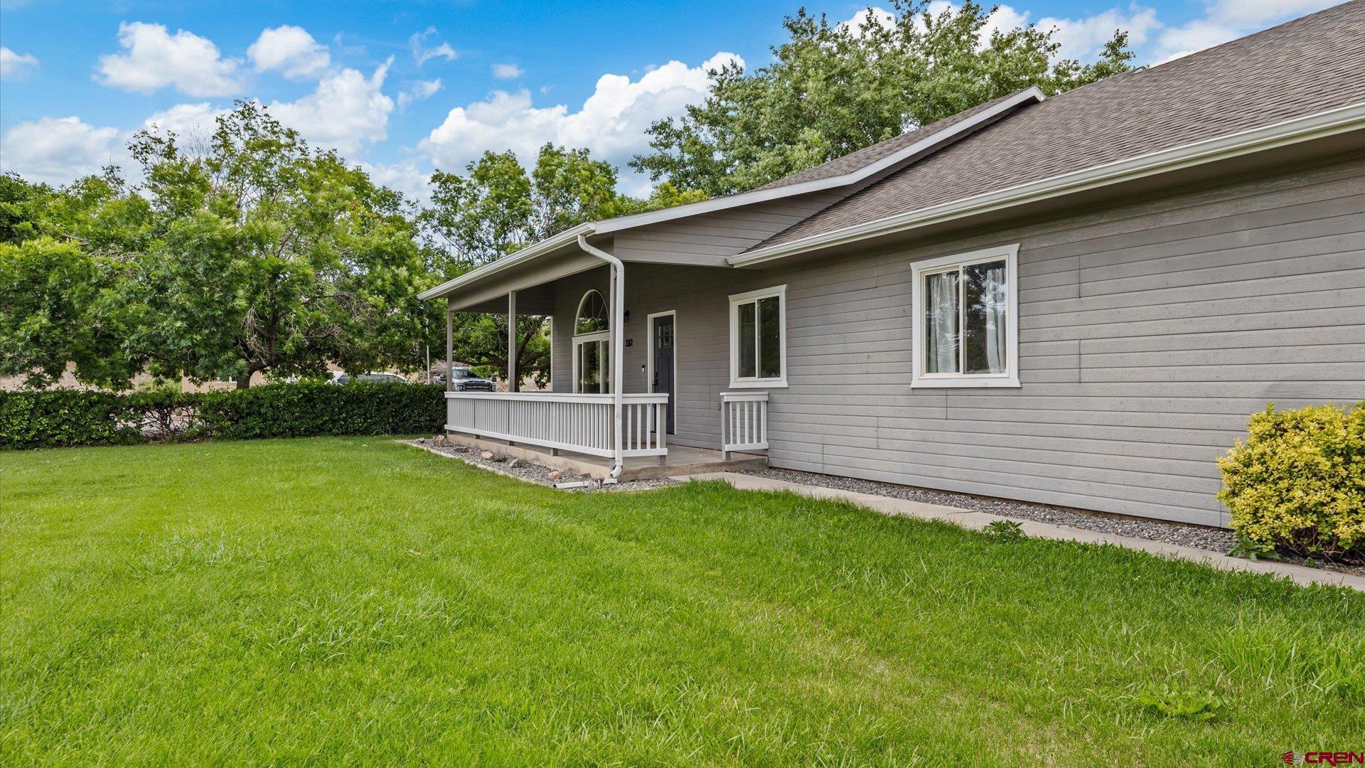 3312 East 1/4 Road Clifton, CO 81520 - Photo 11 of 43 a backyard of a house with table and chairs
