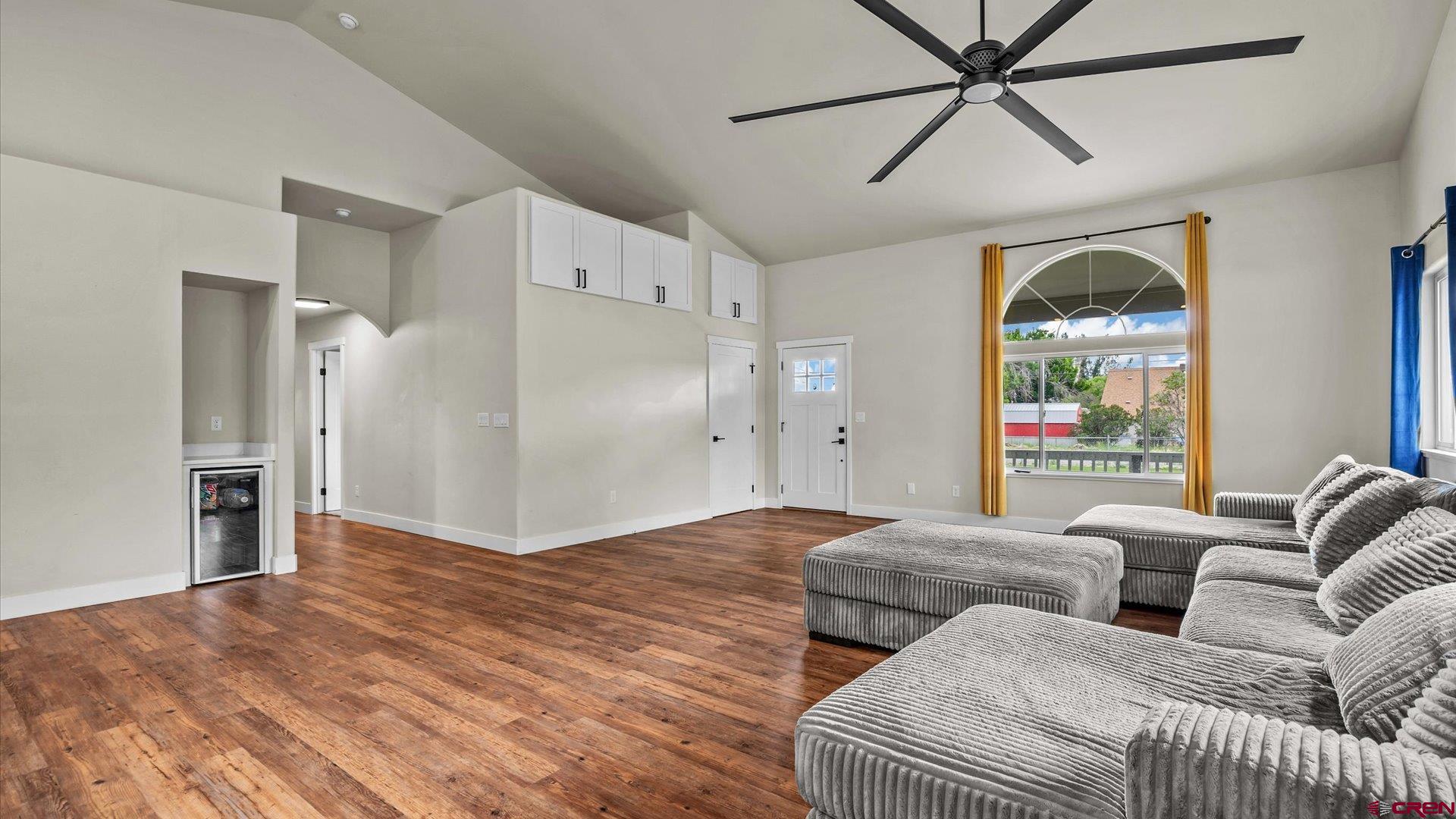 3312 East 1/4 Road Clifton, CO 81520 - Photo 16 of 43 a living room with furniture and a large window