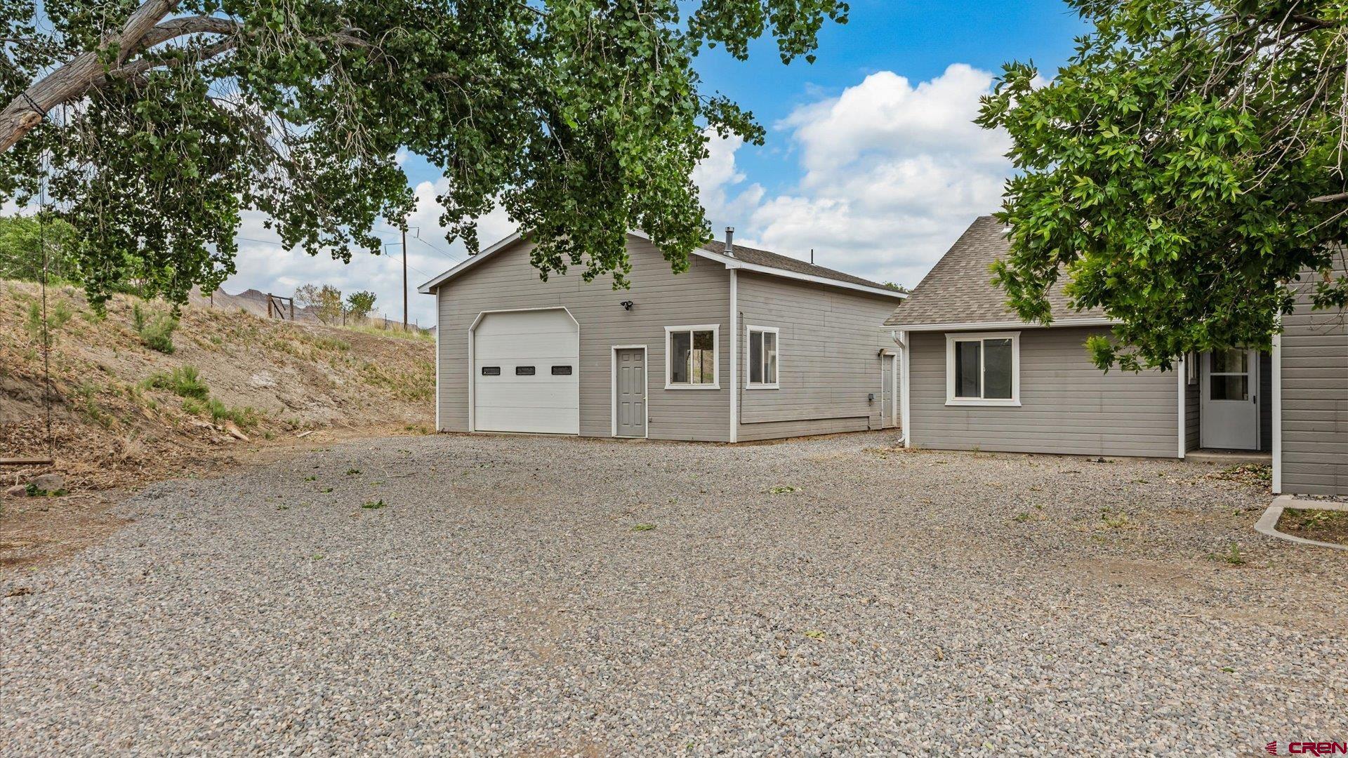 3312 East 1/4 Road Clifton, CO 81520 - Photo 2 of 43 front view of a house with a trees