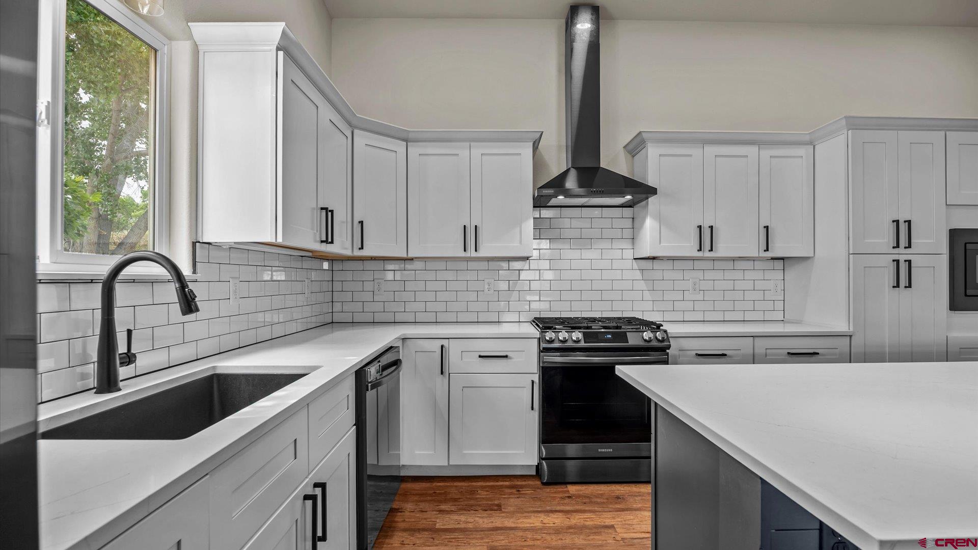 3312 East 1/4 Road Clifton, CO 81520 - Photo 21 of 43 a kitchen with a sink a stove and cabinets