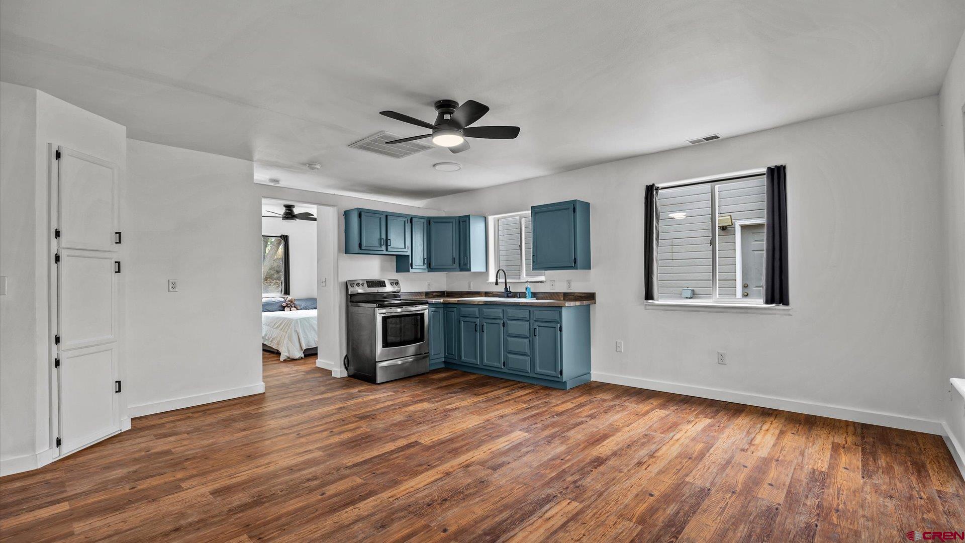 3312 East 1/4 Road Clifton, CO 81520 - Photo 33 of 43 a kitchen with stainless steel appliances a stove top oven a sink and a refrigerator