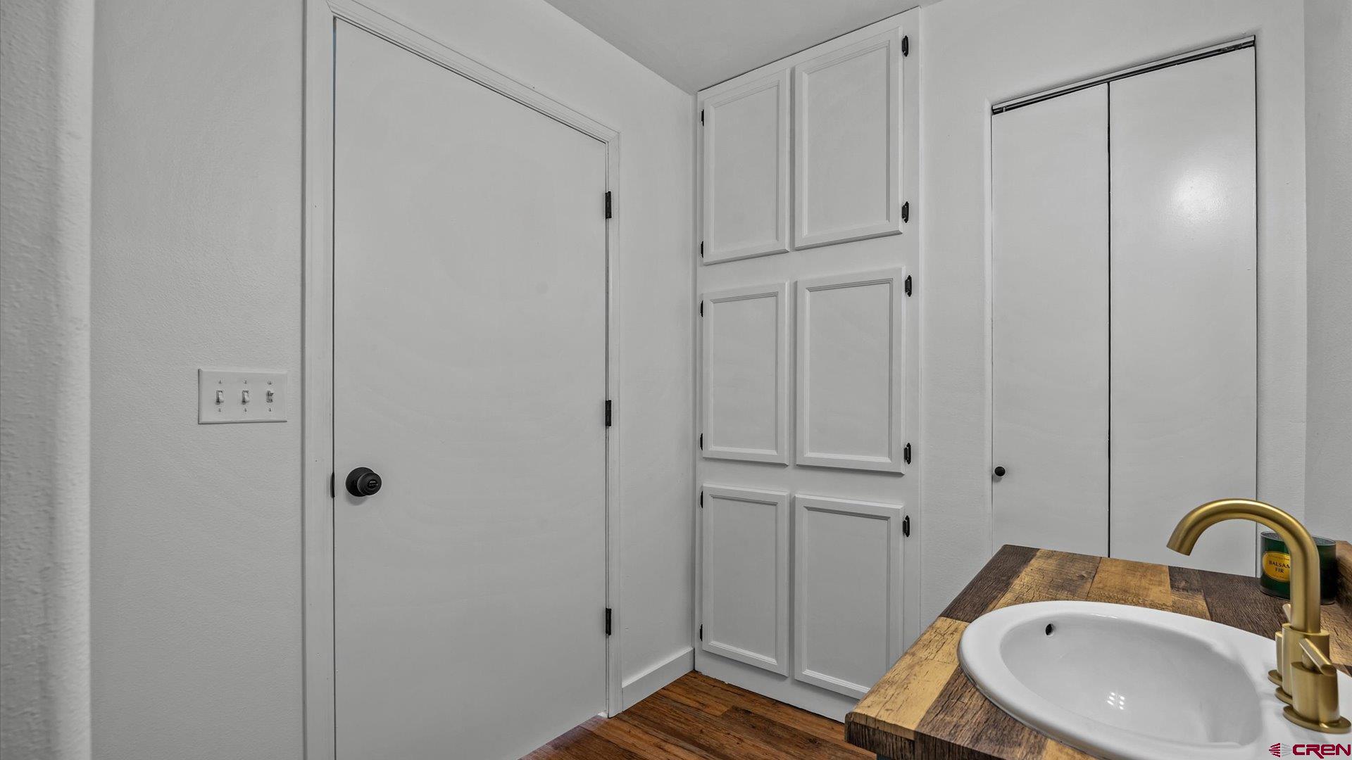 3312 East 1/4 Road Clifton, CO 81520 - Photo 37 of 43 a bathroom with a sink and a mirror