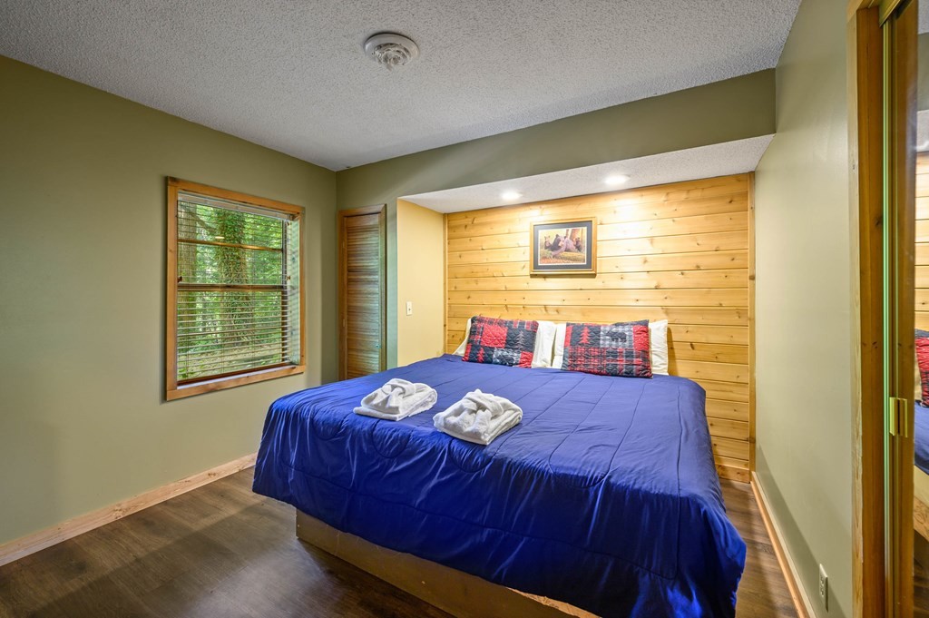 4296 Powdermill Estates Road Sevierville, TN 37876 - Photo 44 of 55 a bedroom with a bed and a window