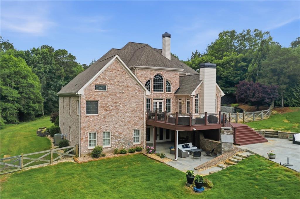 2950 Callie Still Road Lawrenceville, GA 30045 - Photo 53 of 77 a view of a house with a yard porch and sitting area