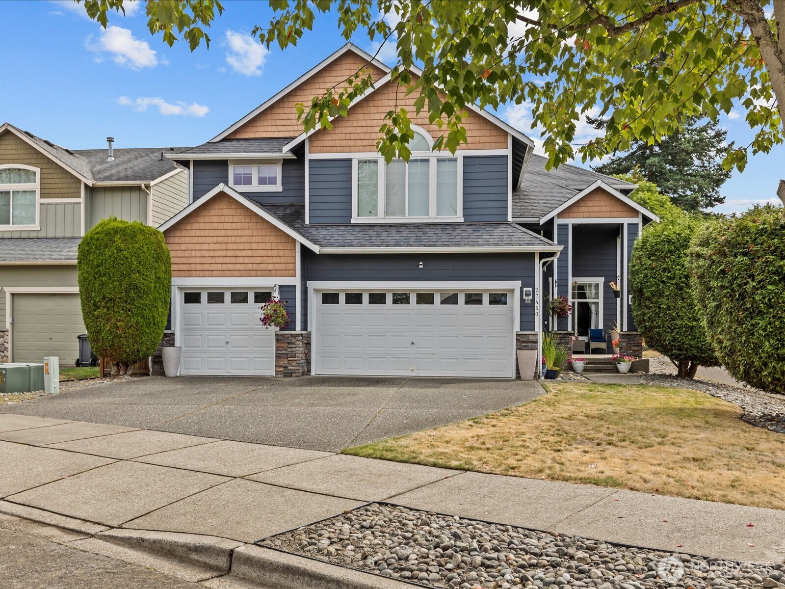 27450 237th Place Southeast Maple Valley, WA 98038 - Photo 2 of 35 a view of a house with a yard and large tree