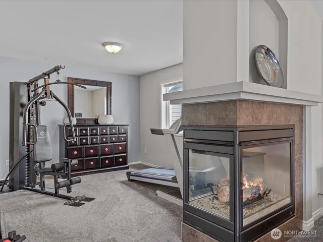 a room with lots of furniture and a fireplace