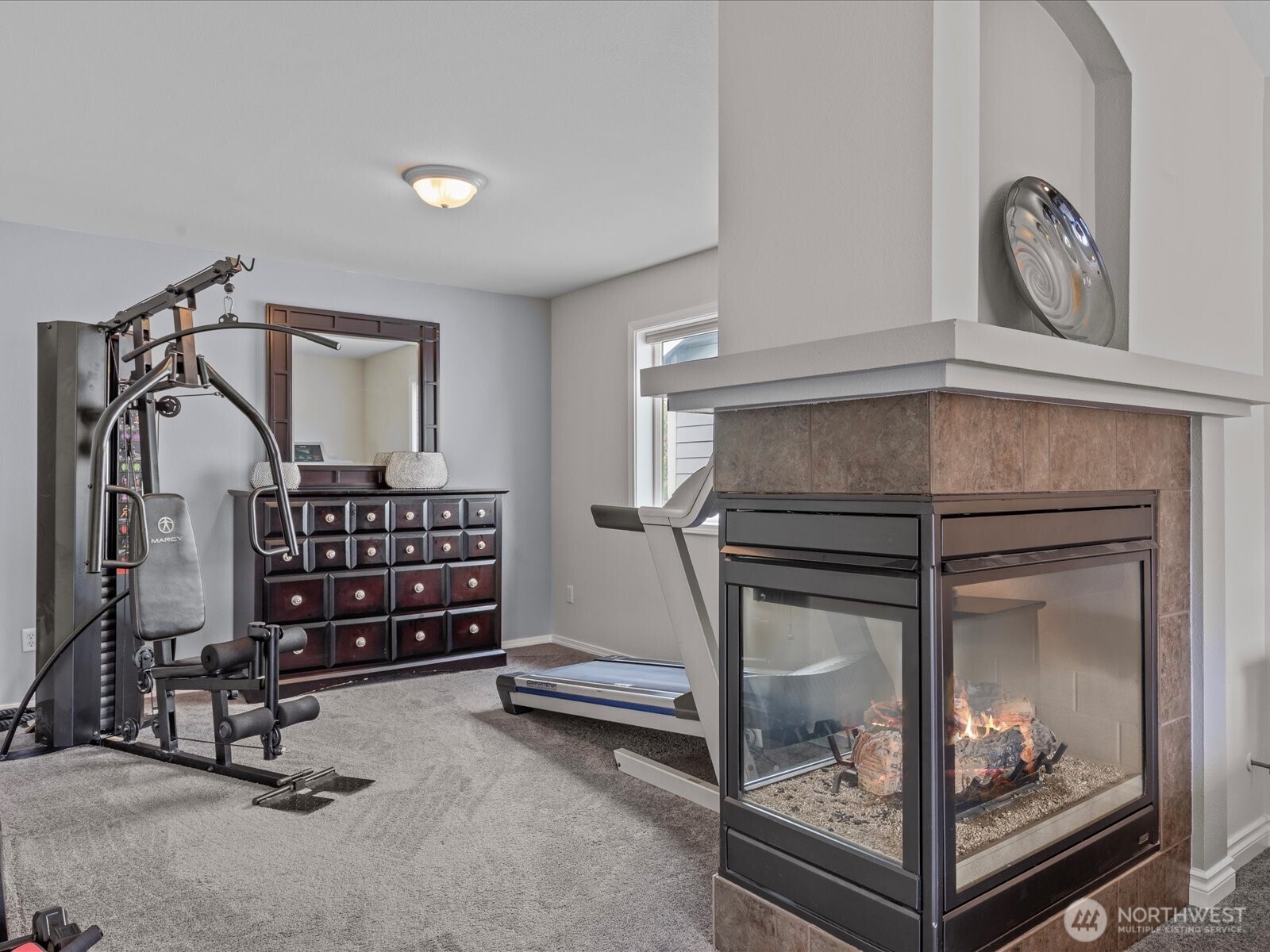 27450 237th Place Southeast Maple Valley, WA 98038 - Photo 24 of 36 a room with lots of furniture and a fireplace