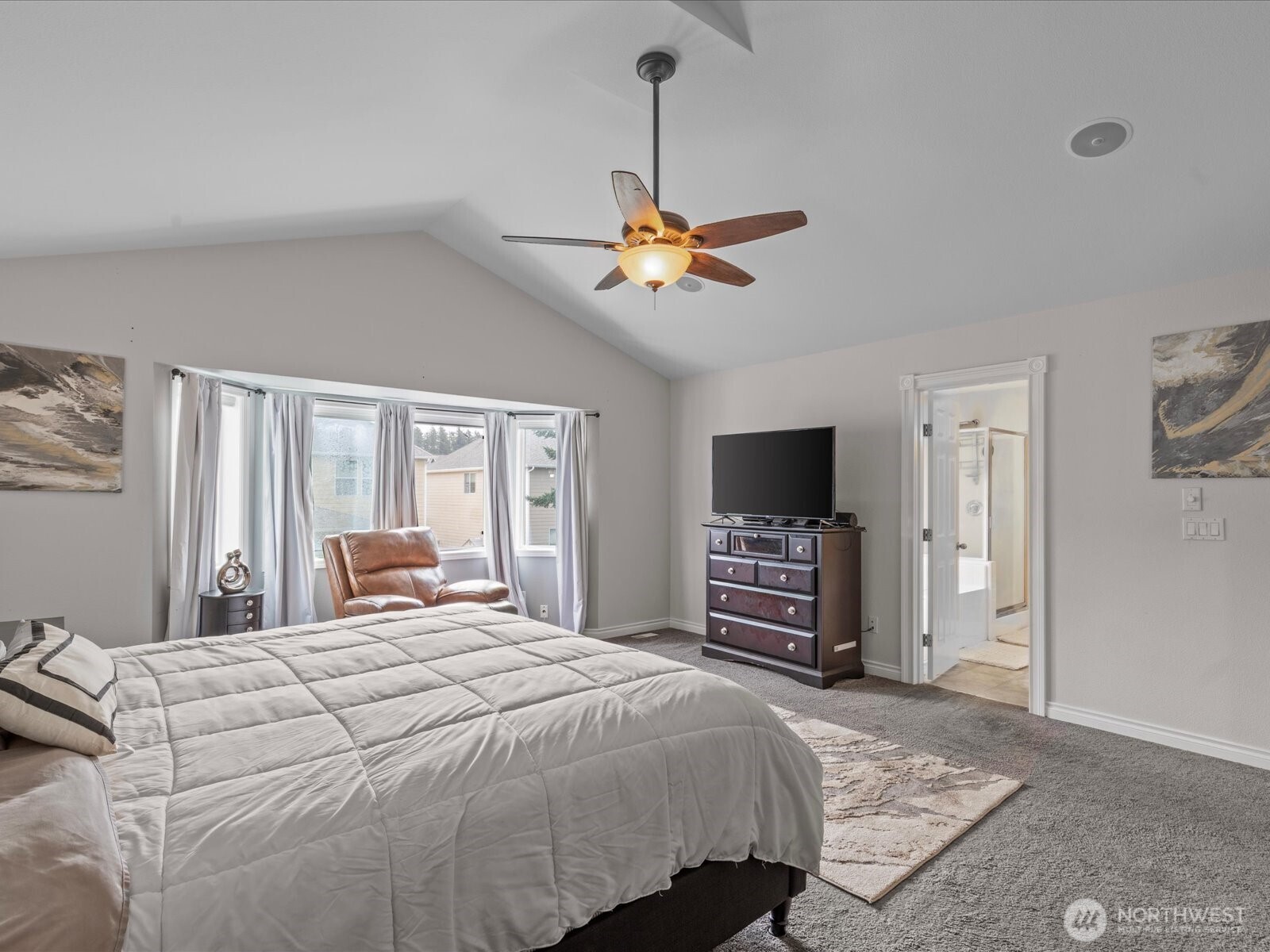 27450 237th Place Southeast Maple Valley, WA 98038 - Photo 25 of 36 a bedroom with a bed and a flat screen tv