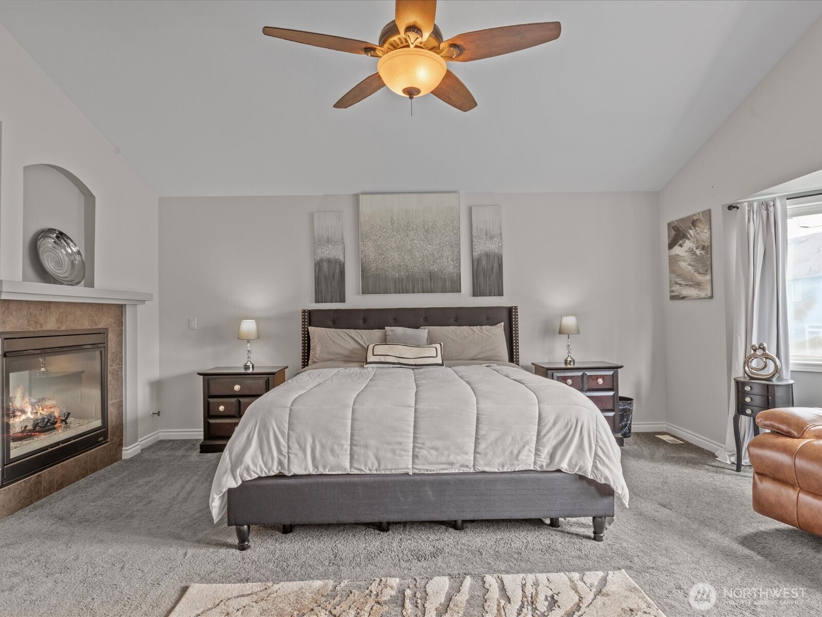 27450 237th Place Southeast Maple Valley, WA 98038 - Photo 26 of 36 a bedroom with a bed and a fireplace