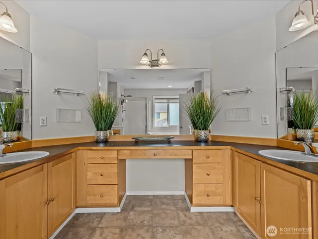 a bath room with a sink and a mirror