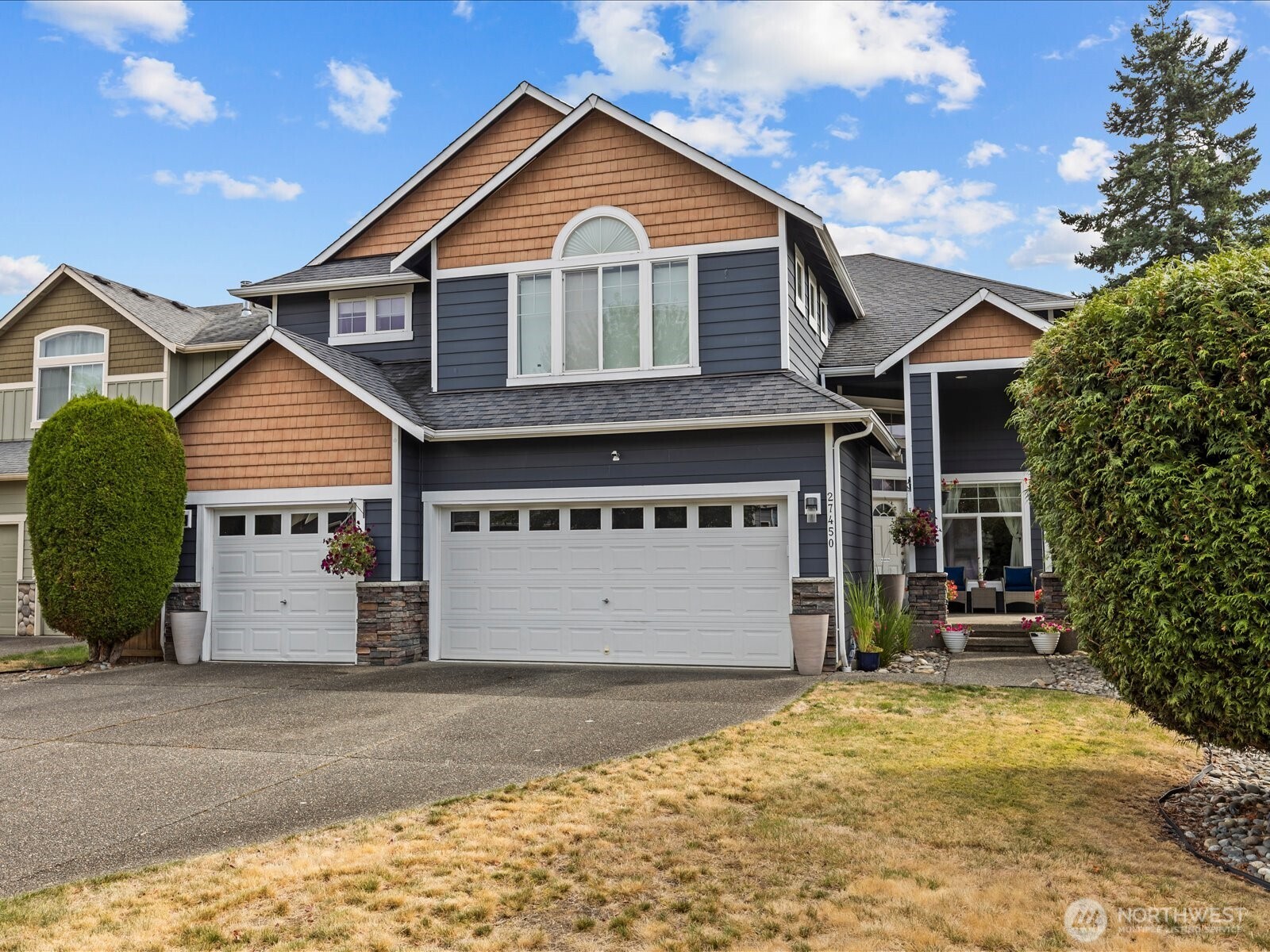 27450 237th Place Southeast Maple Valley, WA 98038 - Photo 3 of 35 a view of a house with a yard