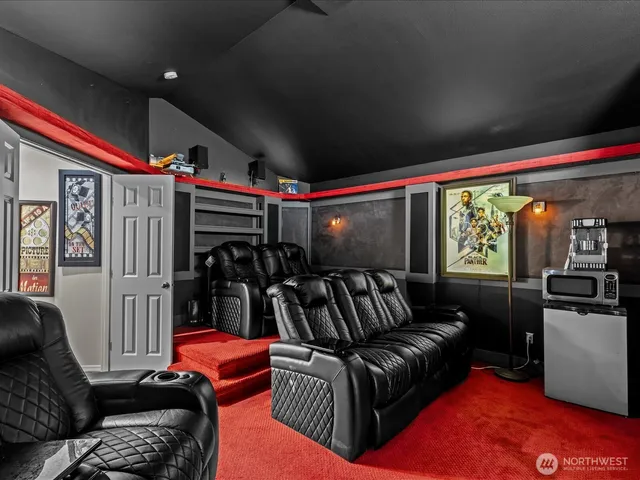 a living room with furniture a flat screen tv and a floor to ceiling window