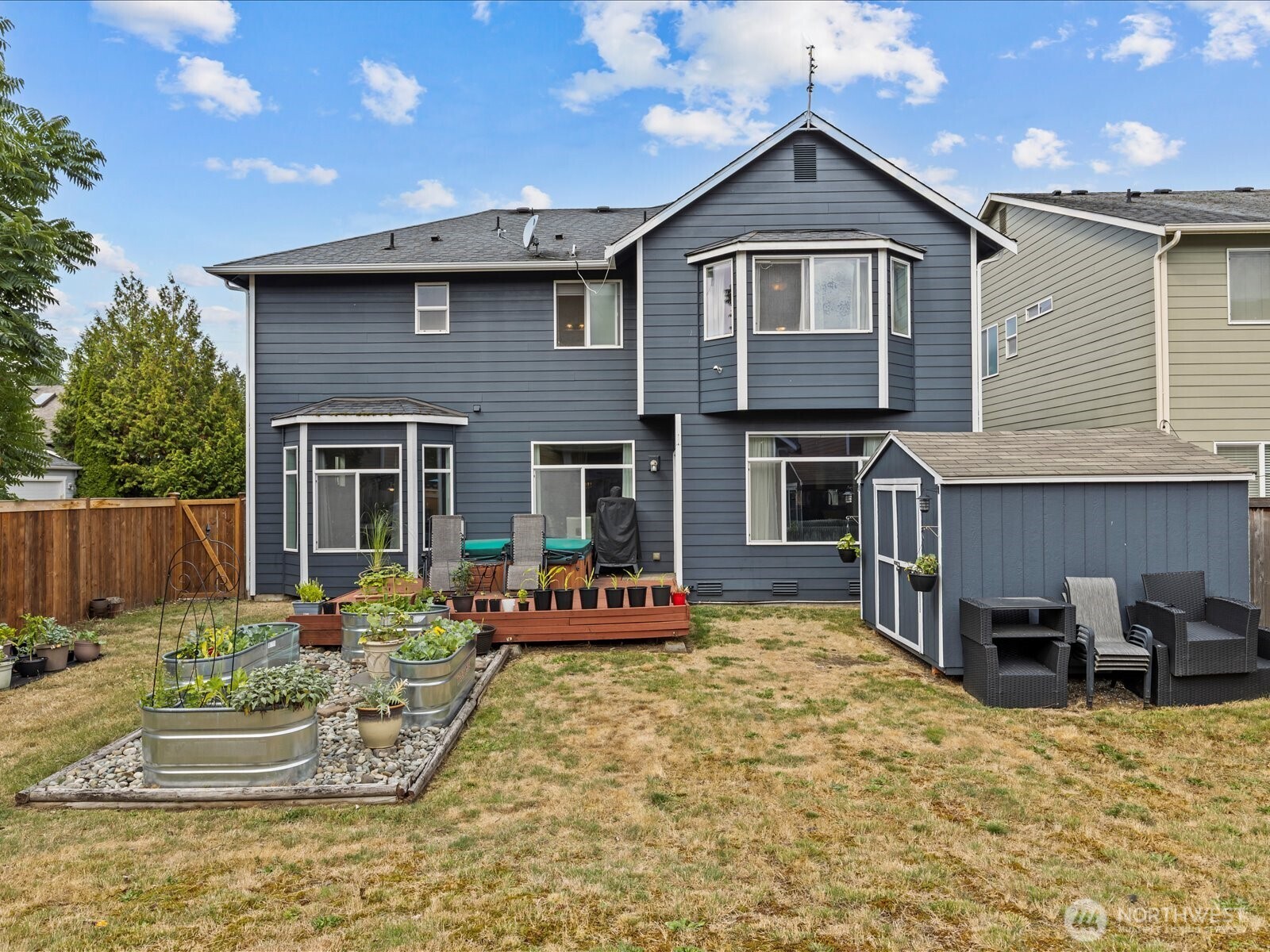 27450 237th Place Southeast Maple Valley, WA 98038 - Photo 33 of 35 a front view of a house with a yard