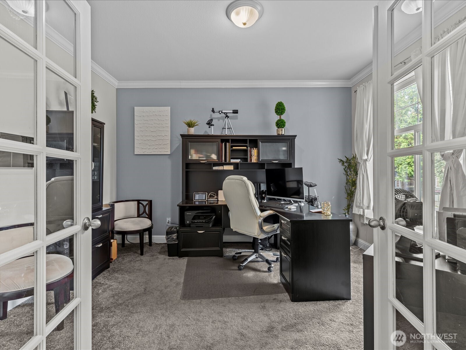 27450 237th Place Southeast Maple Valley, WA 98038 - Photo 6 of 36 a view of a workspace with furniture and a window
