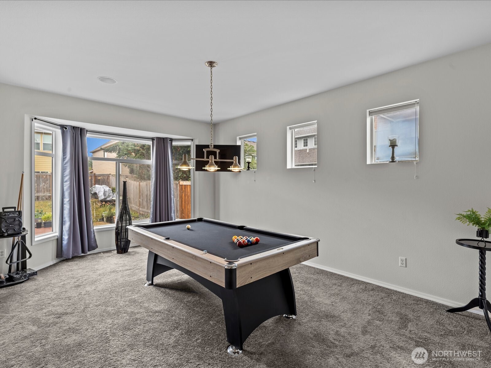27450 237th Place Southeast Maple Valley, WA 98038 - Photo 8 of 35 a living room with furniture pool table and a flat screen tv