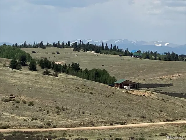 a view of a lake with houses in the back